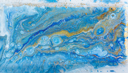 Naklejka premium Blue and gold marbling pattern. Golden marble liquid texture.