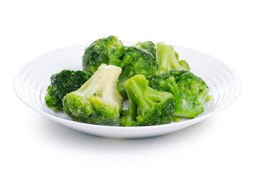 Frozen broccoli in plate on a white background. Isolation