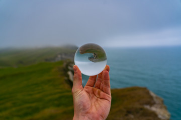 lens ball on the coast of cape farewell in New Zealand, crystal glas ball in the beach of New Zealand, 