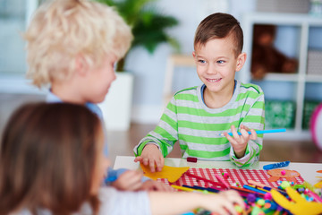 Happy boy having fun on art class