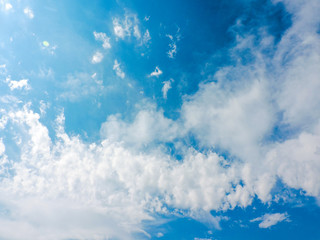 Obraz premium Blue sky with cloud.Sunshine clouds sky during morning background. Over the Clouds. Cloudscape. Blue sky and white cloud. Sunny day. Cumulus cloud. Blue backdrop in the air for text. Top view sky.