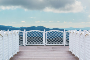 White balcony with perspective wood floor nature background.
