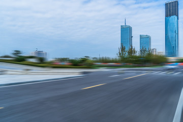 empty road with modern buildings on background, shanghai,china.