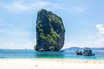 A Thai long tail boat on the beach of Andaman sea located at Krabi near Phuket, Thailand