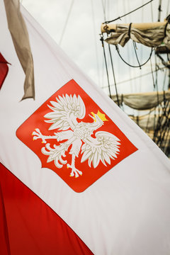 Closeup of polish national flag with emblem