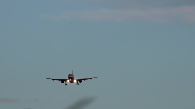 A plane comes in to land at Heathrow airport