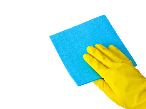 Employee hand in rubber protective glove with micro fiber cloth wiping wall from dust. Cleaning or housekeeping concept background.Getting started cleaning.  Commercial cleaning company. Copy space. 
