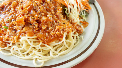 Close up of delicious spaghetti with bolognese and tomato sauce.