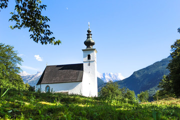 Fototapeta na wymiar White church in the alps