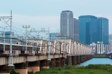 Landscape of osaka city at Umeda from across the Yodogawa River.