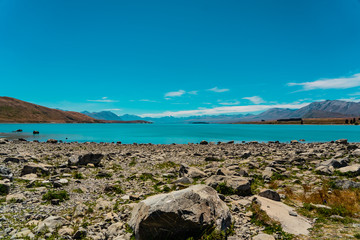 beautiful wide look over lake tekapo in New Zealand, Majestic mountain lake in New Zealand, lake tekapo wallpaper image, amazing lake with mountains in the background