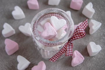 Marshmallows hearts white and pink color on gray background.  Valentine's day. Love