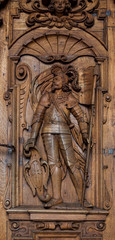 Knight on the wooden door at Hofkirche St. Leodegar - Luzern, Switzerland