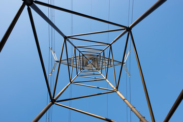 Electricity Pylon Below with Blue Sky in Switzerland.