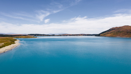 Lake tekapo from the air, aerial shot of the beautiful lake tekapro in New Zealand, stunning blue water lake in New Zealand, aerial photography of amazing nature, nature photography with a drone,
