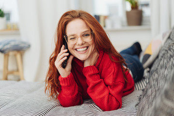 Playful young woman winking at the viewer