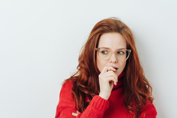 Anxious young woman looking to the side