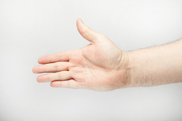Male hand in the greeting pose