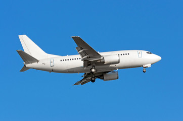 Aircraft approach before landing with landing gear, side view