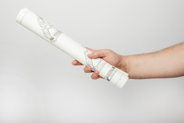 Male hand holds a blueprint