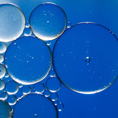 Colorful oil drops on a water surface ideal for abstract background
