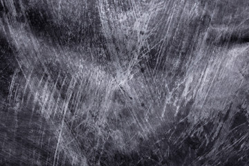 Random and messy horizontal chalk textured background over vintage blackboard - with copy space