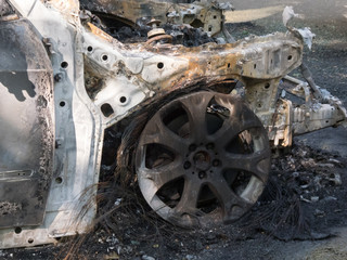 Abandoned damaged and burnt out car