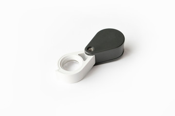 Magnifying glass for diamonds or see the amulet Isolated on a White Background.