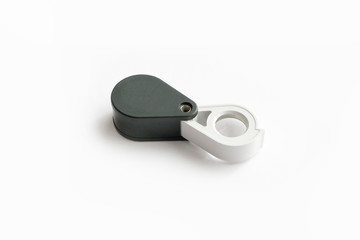 Magnifying glass for diamonds or see the amulet Isolated on a White Background.