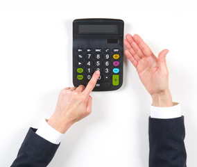 Hands businesswoman and black calculator
