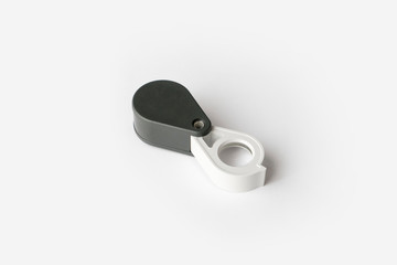 Magnifying glass for diamonds or see the amulet Isolated on a White Background.