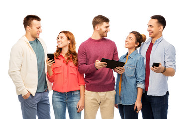 friendship and people concept - group of smiling friends with smartphones and tablet computer over white background