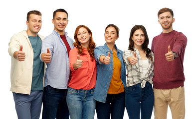 gesture, friendship and people concept - group of smiling friends showing thumbs up over white background