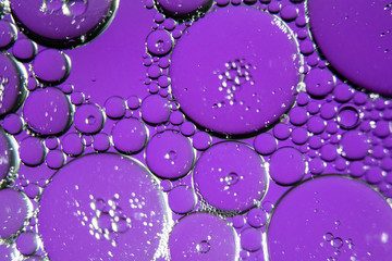 Colorful oil drops on a water surface ideal for abstract background