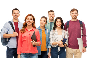 Obraz premium education, high school and people concept - group of smiling students with books over white background