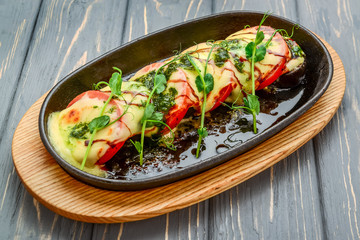 Grilled caprese chicken with mozzarella cheese basil and tomatoes