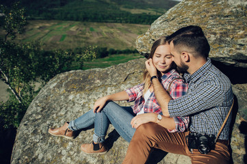 Happy young couple in mountain.