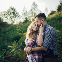 Happy young couple in mountain.