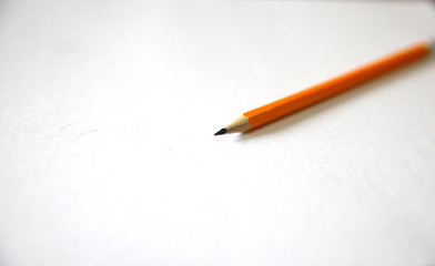 Yellow pencil on a white background