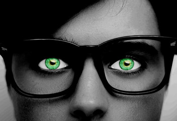 male wearing eyeglasses green eyes close up