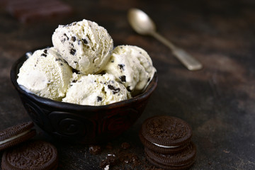 Homemade vanilla ice cream with chocolate and cookies.