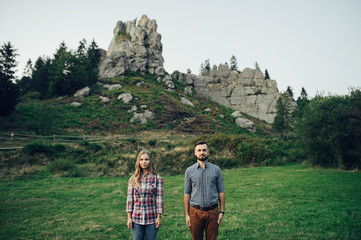 Happy young couple in mountain.
