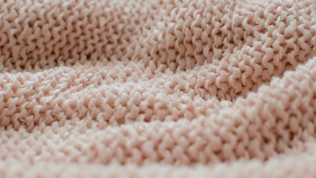The texture of the fabric. Pink knitted texture. Close-up. Can be used as a background. HD 