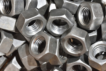 Texture of many metal nuts for product assembly at the factory