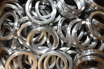 Round rings with internal thread for valve manufacture in the factory. Many round rings for industrial valve manufacturing. Texture