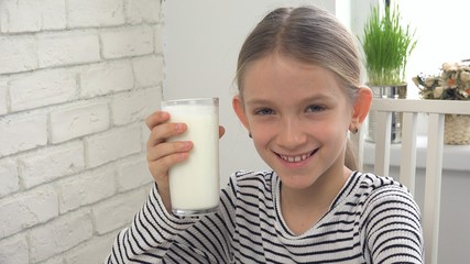 Child Drinking Milk at Breakfast in Kitchen, Girl Tasting Dairy Products