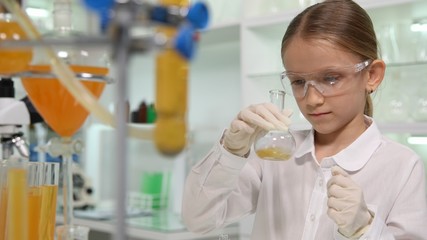 Child Studying Chemistry in School Lab, Student Girl Making Experiments