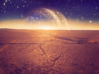 Alien landscape - planet rising over dry cracked desert land. Elements of this image are furnished by NASA#