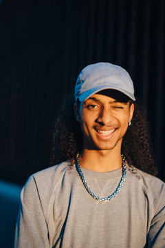 Portrait of young man winking eye