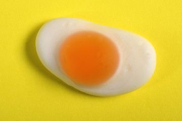 jelly candy fried egg over yellow background